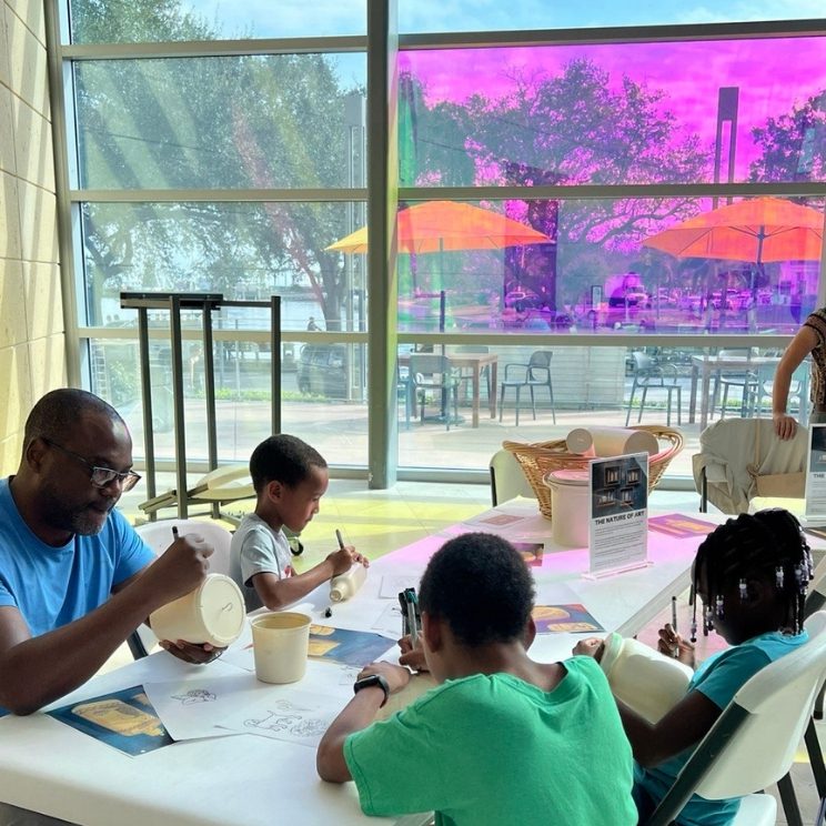 Youth and Family Programs at the MFA. Family enjoying an art project together in a museum.