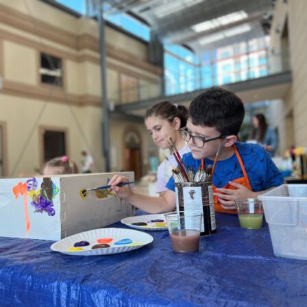 Youth and Family Programs at the MFA. Image of young boy painting a bee box.