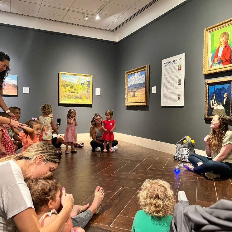 Youth and Family programs at the MFA. Image of young children in an art museum gallery laughing and engaging.