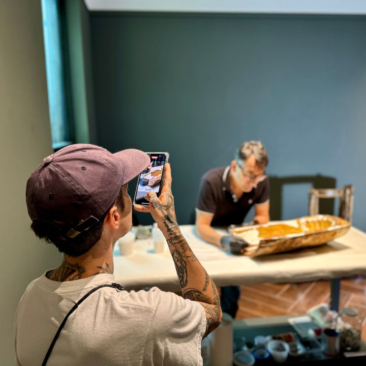 Adult Programs at the MFA. Image of man taking picture of an art conservator at work.