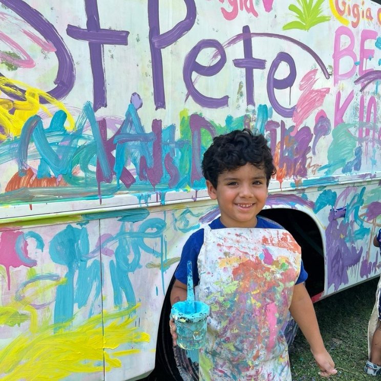 Youth Programs at the MFA. Image of young boy painting a bus.