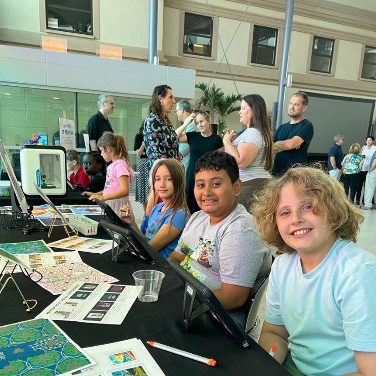 MFA Youth and Family programs. Image of youth doing an art project in a museum.