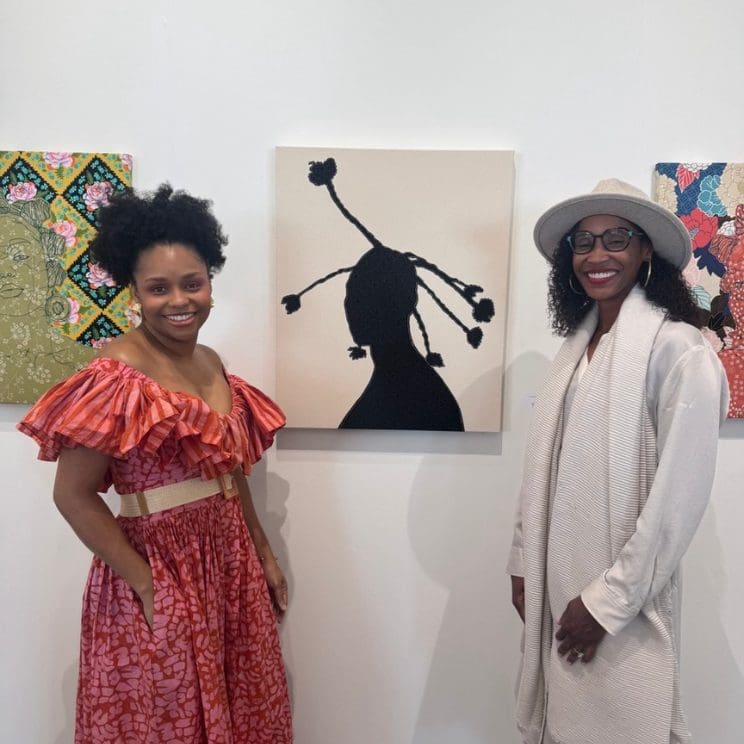 The Collectors Circle at the Museum of Fine Arts, St. Petersburg - Image of artist and art collector in front of artwork of silhouette of a woman from the shoulders up